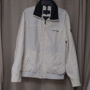 White Windbreaker with Dark Collar with Hilfiger on it and Full-Length Zipper